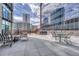 Relaxing rooftop patio featuring city views, comfortable seating, and barbecue grills at 1777 Larimer St # 2201, Denver, CO 80202