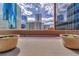 Rooftop patio featuring potted plants and expansive cityscape views, with reflective buildings at 1777 Larimer St # 2201, Denver, CO 80202