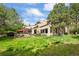Beautiful backyard with lush greenery, a patio, and a well-maintained lawn at 2107 Ridge Plaza Dr, Castle Rock, CO 80108