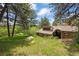 Charming home nestled in a wooded setting, boasting mature trees and a lush green lawn at 2107 Ridge Plaza Dr, Castle Rock, CO 80108