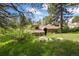 Charming home surrounded by lush trees and landscaping at 2107 Ridge Plaza Dr, Castle Rock, CO 80108