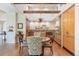 Beautiful open kitchen with custom cabinets, hardwood floors, and modern chandelier at 2107 Ridge Plaza Dr, Castle Rock, CO 80108