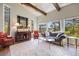 Bright living room with large windows offering natural light and tree views at 2107 Ridge Plaza Dr, Castle Rock, CO 80108