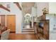 Bright open-concept living room with fireplace, hardwood floors and access to the front entrance at 2107 Ridge Plaza Dr, Castle Rock, CO 80108