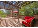 Relaxing outdoor patio featuring a pergola, stone accents, and comfortable lounge furniture at 2107 Ridge Plaza Dr, Castle Rock, CO 80108