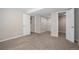 Unfinished basement featuring doorways and neutral walls offering potential for customization and additional living space at 22002 E Irish Dr, Aurora, CO 80016