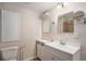 Clean bathroom featuring a white vanity with modern fixtures and a large mirror, providing a functional and stylish space at 22002 E Irish Dr, Aurora, CO 80016