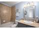 Cozy bathroom featuring a granite counter top, oval sink and shower over tub at 22002 E Irish Dr, Aurora, CO 80016