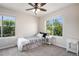 Light-filled bedroom featuring two large windows, plush carpeting, and a comfortable bed, a serene and inviting space at 22002 E Irish Dr, Aurora, CO 80016