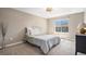 Cozy bedroom features neutral walls, plush carpeting, and a comfortable bed, creating a relaxing retreat at 22002 E Irish Dr, Aurora, CO 80016