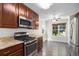 Modern kitchen with stainless steel appliances, granite countertops, and wood cabinetry at 22002 E Irish Dr, Aurora, CO 80016