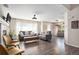 Inviting living area with hardwood floors, stylish seating, fireplace, and natural light at 22002 E Irish Dr, Aurora, CO 80016