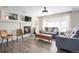 Cozy living room featuring a fireplace, modern decor, and hardwood floors at 22002 E Irish Dr, Aurora, CO 80016