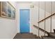Hallway Entrance featuring blue door, stairway, and exit sign at 320 S Ames St # 5, Lakewood, CO 80226