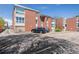 Apartment building showcasing parking and brick exterior with modern windows and architectural design at 320 S Ames St # 5, Lakewood, CO 80226