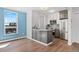Kitchen area featuring updated stainless steel appliances, modern cabinetry, and granite countertops at 320 S Ames St # 5, Lakewood, CO 80226