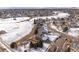 An aerial view shows the home's location near a pond and within a well-established neighborhood at 751 Wyndemere Dr, Longmont, CO 80504