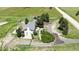 Detailed aerial view showing the property's home, back deck, trampoline, landscaping, and surrounding expansive land at 45321 Summit Rd, Parker, CO 80138