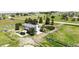 Broad aerial shot displays the back of the home, patio, and surrounding acreage at 45321 Summit Rd, Parker, CO 80138