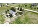 Wide aerial perspective of the home showcasing its location, back deck, trampoline, landscaping, and extensive surrounding acreage at 45321 Summit Rd, Parker, CO 80138