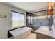 This bathroom has a free-standing tub and large shower and a beautiful view at 45321 Summit Rd, Parker, CO 80138