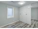 Bedroom featuring vinyl floors, a window, and built-in white storage at 45321 Summit Rd, Parker, CO 80138