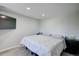 This bedroom features carpet, a bed, and black bedside tables at 45321 Summit Rd, Parker, CO 80138