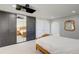 This bedroom features carpet, a bed, built in storage, and a mirror at 45321 Summit Rd, Parker, CO 80138