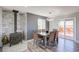 Cozy dining area with a wood-burning stove and access to the outdoor deck at 45321 Summit Rd, Parker, CO 80138