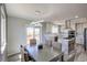Bright dining area featuring modern lighting, access to the outdoor deck, and views at 45321 Summit Rd, Parker, CO 80138