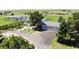 Aerial view of the home with a three car garage and well manicured landscaping at 45321 Summit Rd, Parker, CO 80138