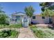 Charming single Gathering home featuring a welcoming front porch, manicured landscaping, and stone walkway leading to the front door at 45321 Summit Rd, Parker, CO 80138