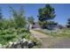 Attractive home with front yard with mature trees and a lush garden at 45321 Summit Rd, Parker, CO 80138