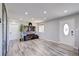 Living Room features recessed lighting, wood floors, big screen TV, and lots of natural light at 45321 Summit Rd, Parker, CO 80138