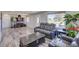 Sun-filled living room with wood flooring and a large picture window offering outdoor views at 45321 Summit Rd, Parker, CO 80138