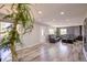Bright living room featuring wood floors, lots of light, and modern furnishings at 45321 Summit Rd, Parker, CO 80138