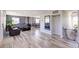Open living room design with a wood burning fireplace, hardwood floors and plenty of light at 45321 Summit Rd, Parker, CO 80138