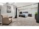 Finished basement bedroom featuring a comfortable chair and carpet floors at 2974 S Parker Ct, Aurora, CO 80014