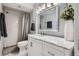 Bright bathroom featuring a shower-tub combination and a marble vanity at 2974 S Parker Ct, Aurora, CO 80014