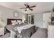 Cozy bedroom featuring a ceiling fan, a closet, and comfortable finishes at 2974 S Parker Ct, Aurora, CO 80014