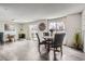 Bright dining room features an open floor plan, vinyl floors, a fireplace, and backyard access at 2974 S Parker Ct, Aurora, CO 80014