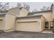 Home exterior featuring a large garage and entry door with a neutral color palette at 2974 S Parker Ct, Aurora, CO 80014