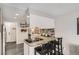 Bright kitchen features granite counters, mosaic backsplash, and an eat-in bar at 2974 S Parker Ct, Aurora, CO 80014