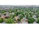 Aerial view of the neighborhood with lush greenery and a glimpse of the city skyline at 588 S Grant St, Denver, CO 80209