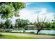 Scenic view of City Park lake with the pavilion and a vibrant skyline in the background at 588 S Grant St, Denver, CO 80209