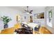 Bright dining area with hardwood floors, ample seating, and views of the kitchen at 588 S Grant St, Denver, CO 80209