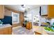 Cozy kitchen featuring exposed brick, stainless steel appliances, and a functional layout at 588 S Grant St, Denver, CO 80209