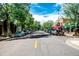 Picturesque street view with mature trees and local shops, creating a vibrant and walkable neighborhood atmosphere at 588 S Grant St, Denver, CO 80209