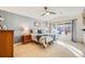 Bedroom with a large window for natural light, ceiling fan, and neutral decor at 14190 Sun Blaze Loop # E, Broomfield, CO 80023