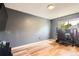Contemporary bedroom with hardwood floors, neutral gray paint, and a window view at 16602 E Gunnison Pl, Aurora, CO 80017